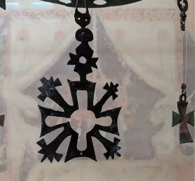 A large decorative cross belonging to the copper accessories for a polykandelon (lamp holder), from 6th century Euboea